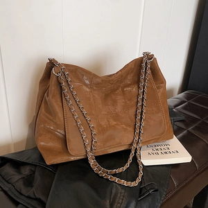 Caramel brown quilted tote bag with vintage gloss finish and silver chain shoulder strap