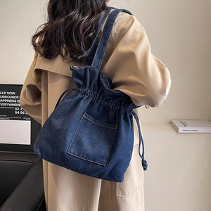 Deep blue denim bucket bag with drawstring closure and large capacity for casual daily wear