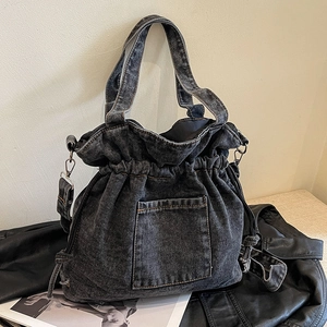 Vintage dark gray washed denim drawstring bucket bag with adjustable wide shoulder strap