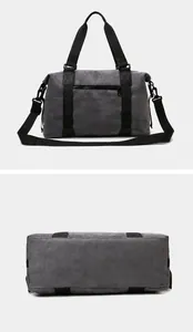 Detailed rear and base views of the large grey travel duffel bag with black straps