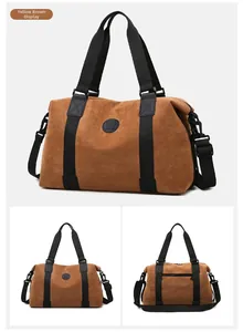 Detail view of large tan travel bag with adjustable straps and back zipper pocket
