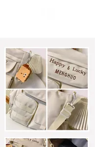 Detail of oxford tote with Lucky embroidery, pockets and cute toast plush pendant