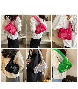 Detailed views of fuzzy shoulder bag in various colors with thick chain and logo patch
