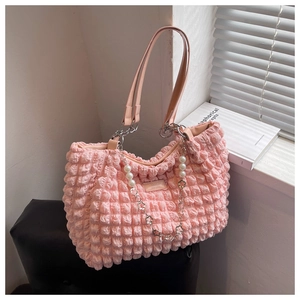 Detail of pink bubble cloud tote bag with pearls and silver flower metal chain