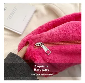 Detailed macro view of the premium silver metal zipper hardware on the pink fluffy bag
