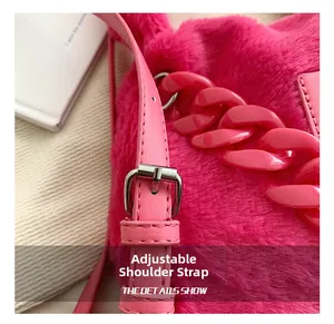 Detail of rose pink plush tote with adjustable shoulder strap and decorative chain