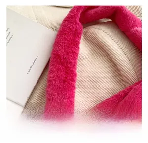Detailed close-up of fluffy pink faux fur strap on a soft winter tote bag for women
