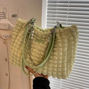 Light green popcorn textured tote bag with elegant pearl chain and floral charms