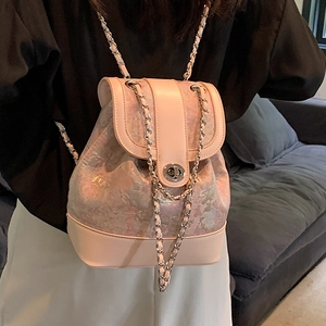 Pale pink jacquard chain backpack for women featuring elegant floral texture and metal lock