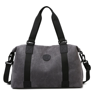 Large gray travel bag with black handles and adjustable strap for sports or business