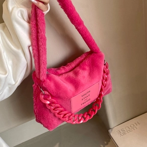 Fuzzy faux fur tote bag in vibrant rose red with plastic chain and youth style tag