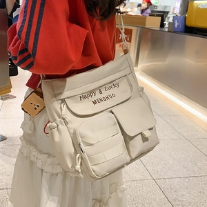 Cream Oxford cloth tote bag with multiple pockets and a cute toast plush pendant