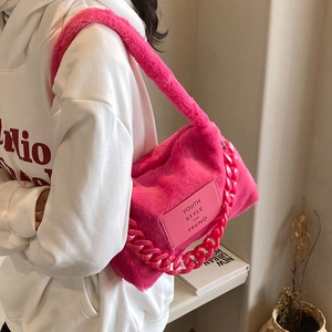 Pink faux fur tote bag with chunky resin chain and leather patch for women
