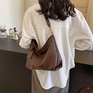Retro dark brown hobo bag with adjustable strap and vintage textured faux leather