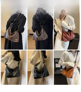 Detail showing the adjustable knotted metal buckle and multiple colors of the tote bag
