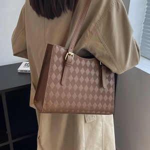 Brown quilted tote bag with adjustable straps for women, classic minimalist commuter style