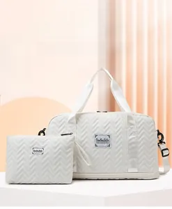 Quilted off-white large travel bag set including main tote and small pouch organizer