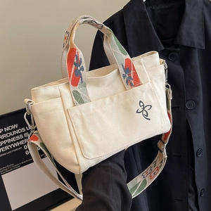 Canvas tote bag with floral pattern straps and butterfly embroidery for daily use