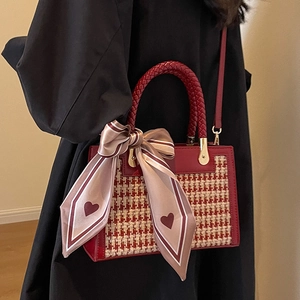 Red houndstooth plaid crossbody bag with woven handle and silk scarf detail