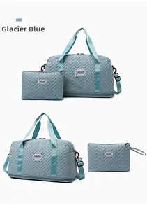 Glacier blue travel bag set featuring V-shaped quilting and a matching clutch bag