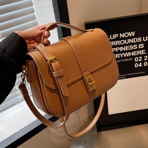 Brown lychee pattern crossbody bag with vintage gold metal clasp and top handle