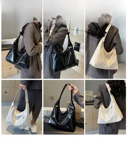 Chic textured leather tote bag shown in black and beige on models for daily commute style