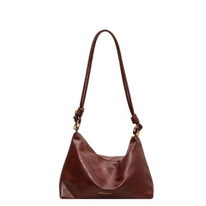 Large vintage brown leather tote bag with knotted straps and gold hardware for women