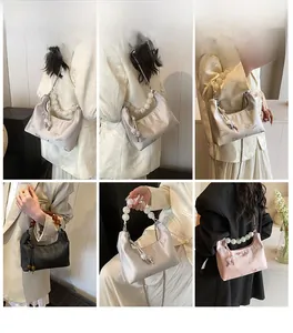 Detailed view of jacquard floral patterns and pearl handles on a Chinese cloud tote bag