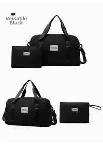 Detail of black chevron quilted travel bag set with large main bag and small pouch