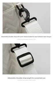 Detail of adjustable nylon strap and detachable swivel hook on large quilted travel bag