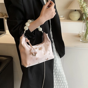 Pink floral embroidered hobo bag with pearl handle and silk-like pleated satin fabric