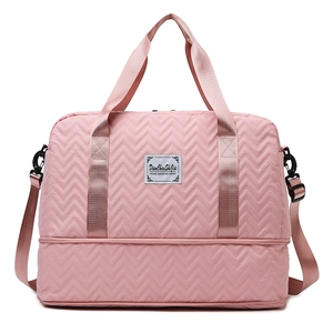 Pink quilted large capacity travel bag with bottom shoe compartment and shoulder strap