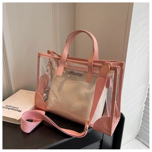 Detail of transparent PVC jelly tote bag with pink inner pouch and adjustable strap