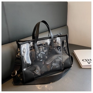 Macro detail of waterproof clear PVC beach tote bag with black leather reinforced edges