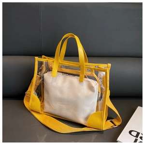 Detail of yellow transparent PVC jelly tote bag with inner pouch and logo strap