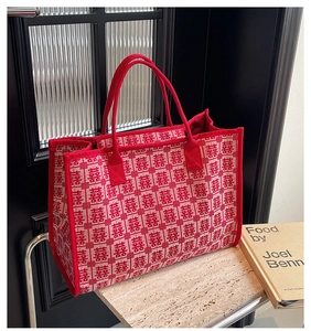 Detailed view of red bridal tote bag with traditional Double Happiness jacquard fabric