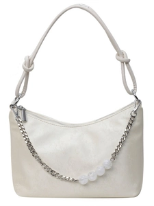Chic beige underarm bag with marble bead chain and knot strap detail on white background