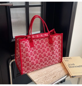 Detail of red wedding tote bag with traditional Double Happiness jacquard pattern