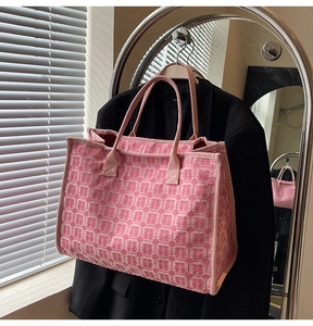 Detail of pink wedding tote bag featuring red Double Happiness embroidery and wide handles