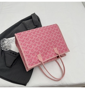 Detail of pink bridal tote bag with traditional Chinese Double Happiness jacquard pattern
