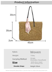 Detail of handwoven straw beach tote bag with pink heart scarf and size measurements