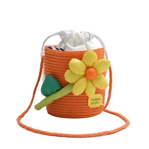 Mini orange woven flower bucket bag with drawstring liner for summer beach vacation