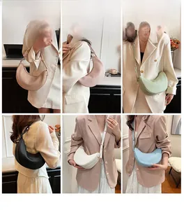 Model showcasing pleated dumpling bag in multiple colors for shoulder and crossbody wear