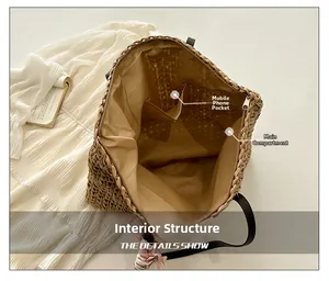 Detail of the woven straw tote interior featuring a phone pocket and zip closure