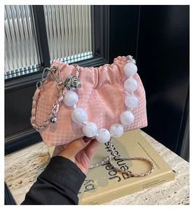 Pink scrunchie cloud bag with large marble pearl handle and silver chain strap details