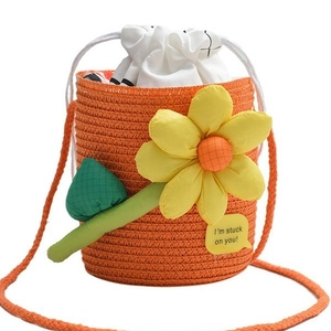 Mini orange straw bucket bag with floral decoration and I'm stuck on you message patch