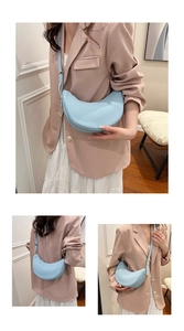 Detail shots of light blue pleated dumpling bag shown on model for various perspectives