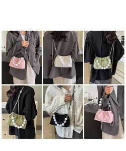 Collage of pleated mini cloud bags in pink, beige, green and black with pearl handles