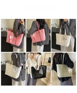Detail view of woven texture tote bags in pink, beige, black and green with silk scarves