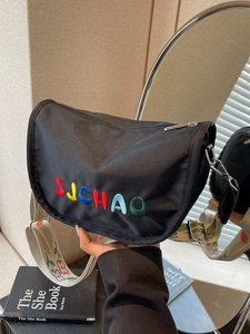 Black nylon crescent bag with SUCHAO embroidery and wide ethnic woven strap